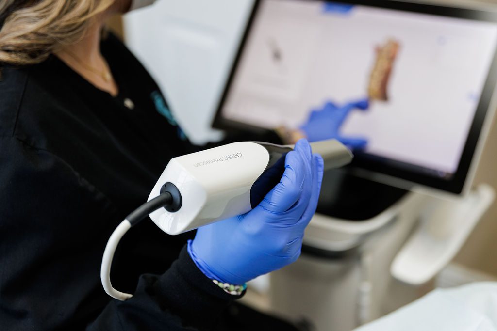 Dentist reviewing digital dental scan during consultation in Valdosta GA.