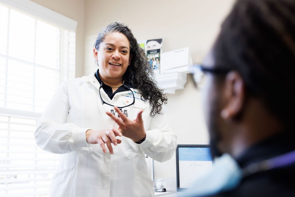 Dentist in Valdosta GA consulting with patient during treatment discussion.