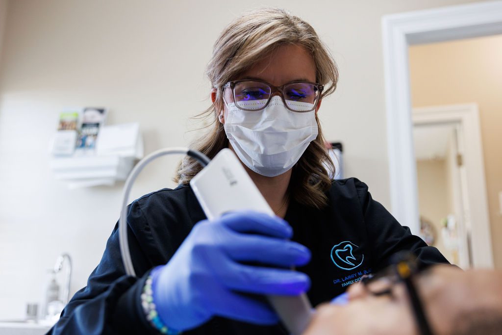 Dental professional using intraoral scanner at Valdosta GA dental office.