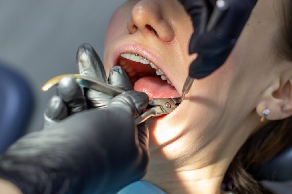 Dentist performing restorative dental procedure in Valdosta GA office.