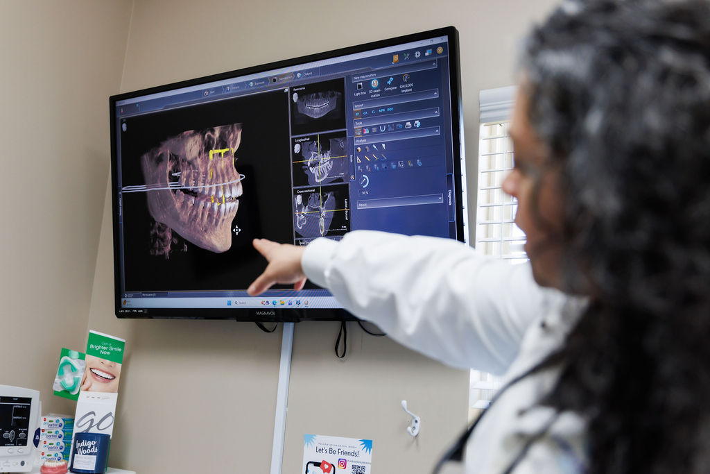 Dentist reviewing digital X-ray results with patient in Valdosta GA.