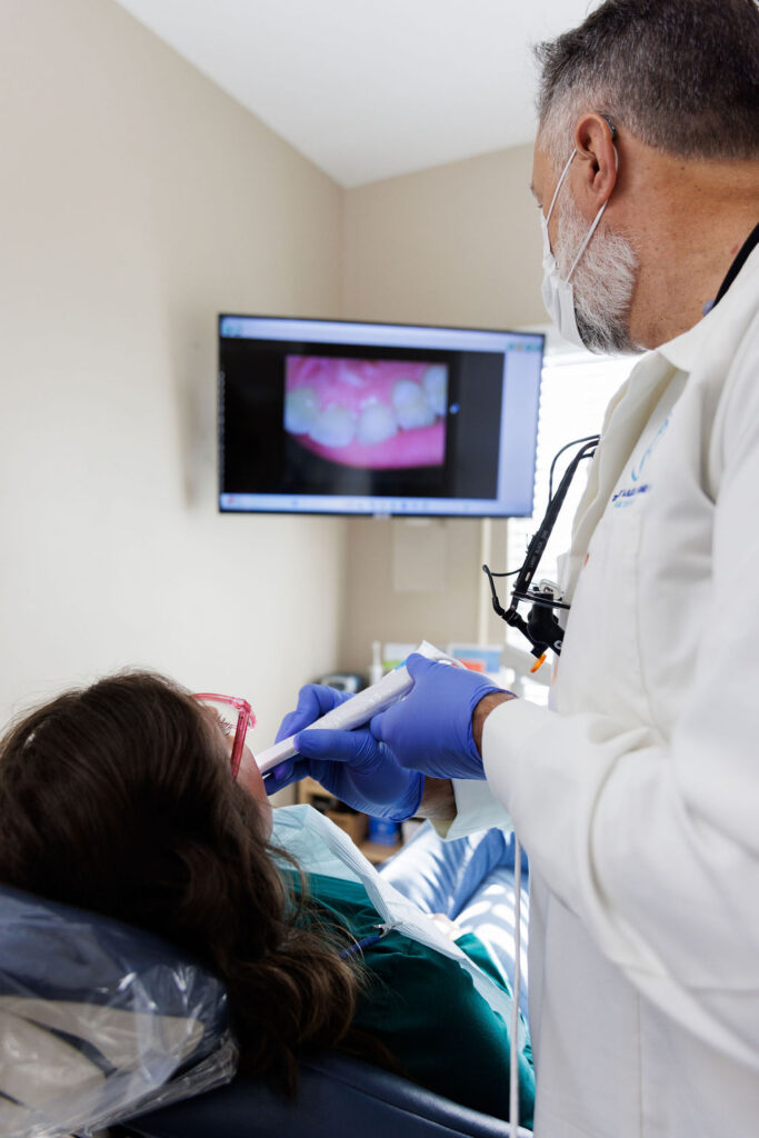 Dentist using handheld intraoral scanner in Valdosta GA.